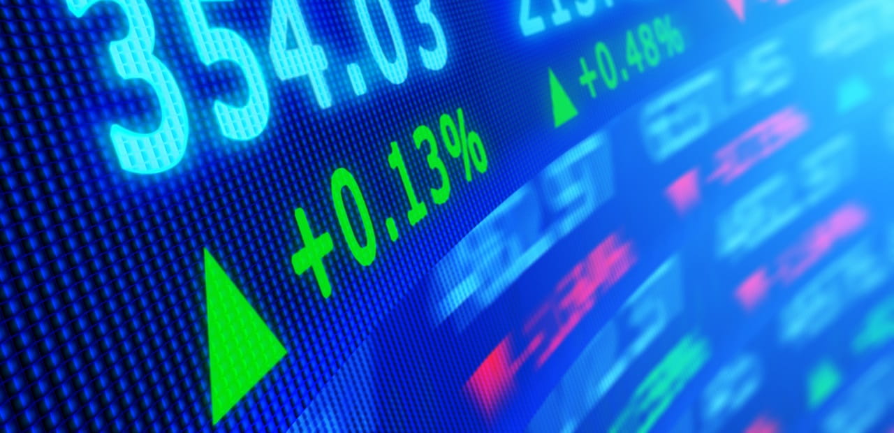 Side angle view of stock market data on video display board