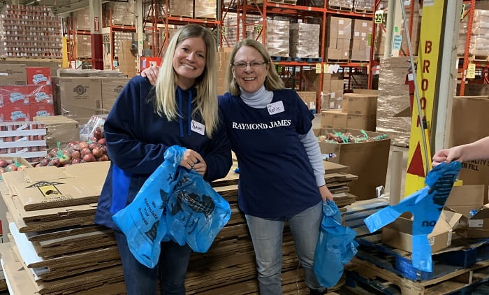 Raymond James associates volunteer with Gleaners Community Food Bank