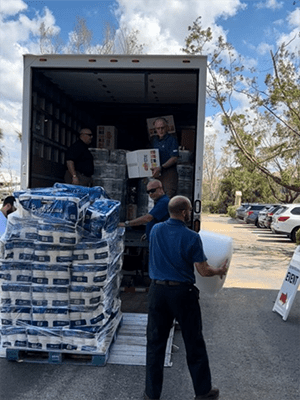 Associates chat with a United Way partner agency at the firm's United Way Day event