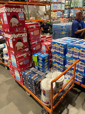 Associates chat with a United Way partner agency at the firm's United Way Day event